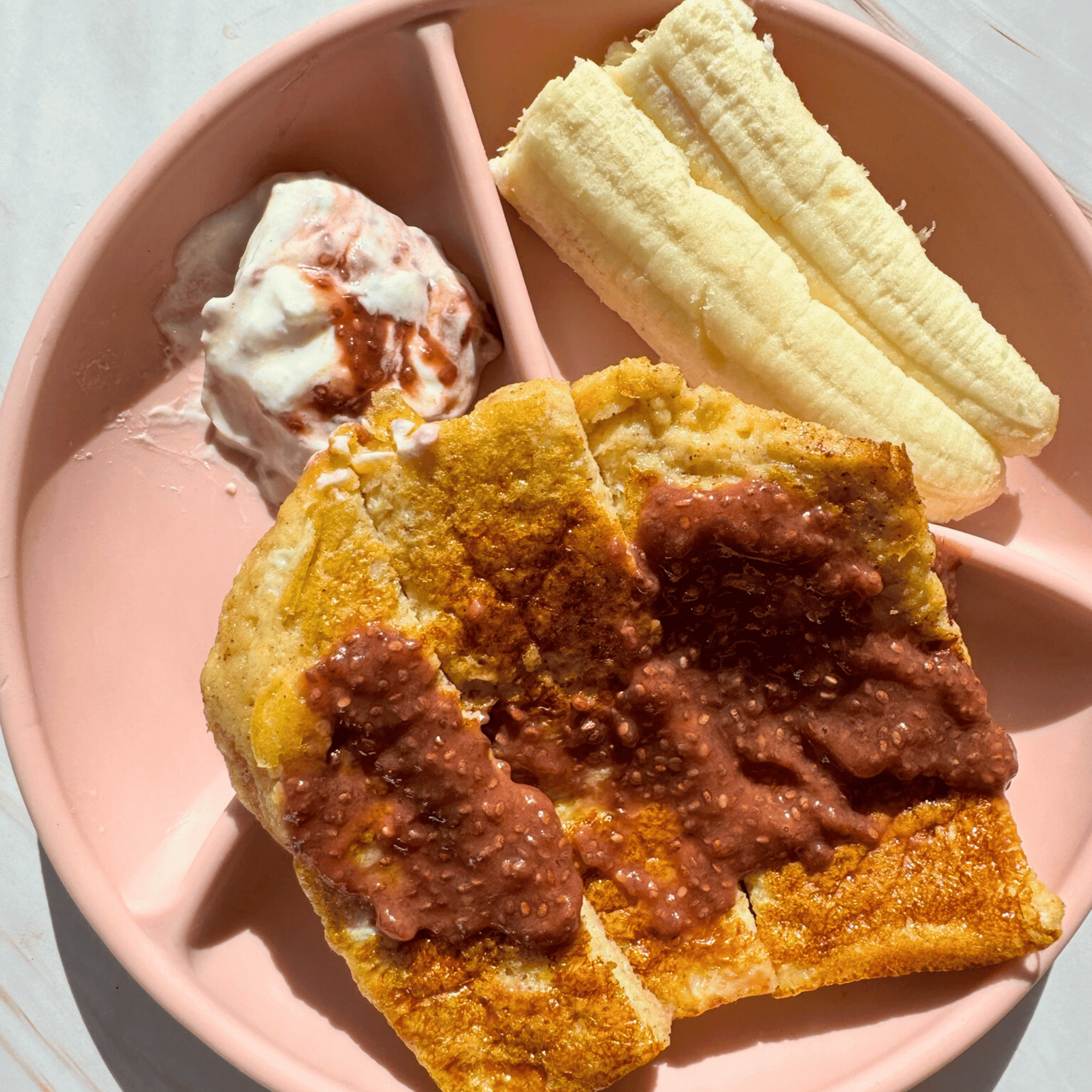 healthy french toast with homemade chia jam served with yoghurt and banana