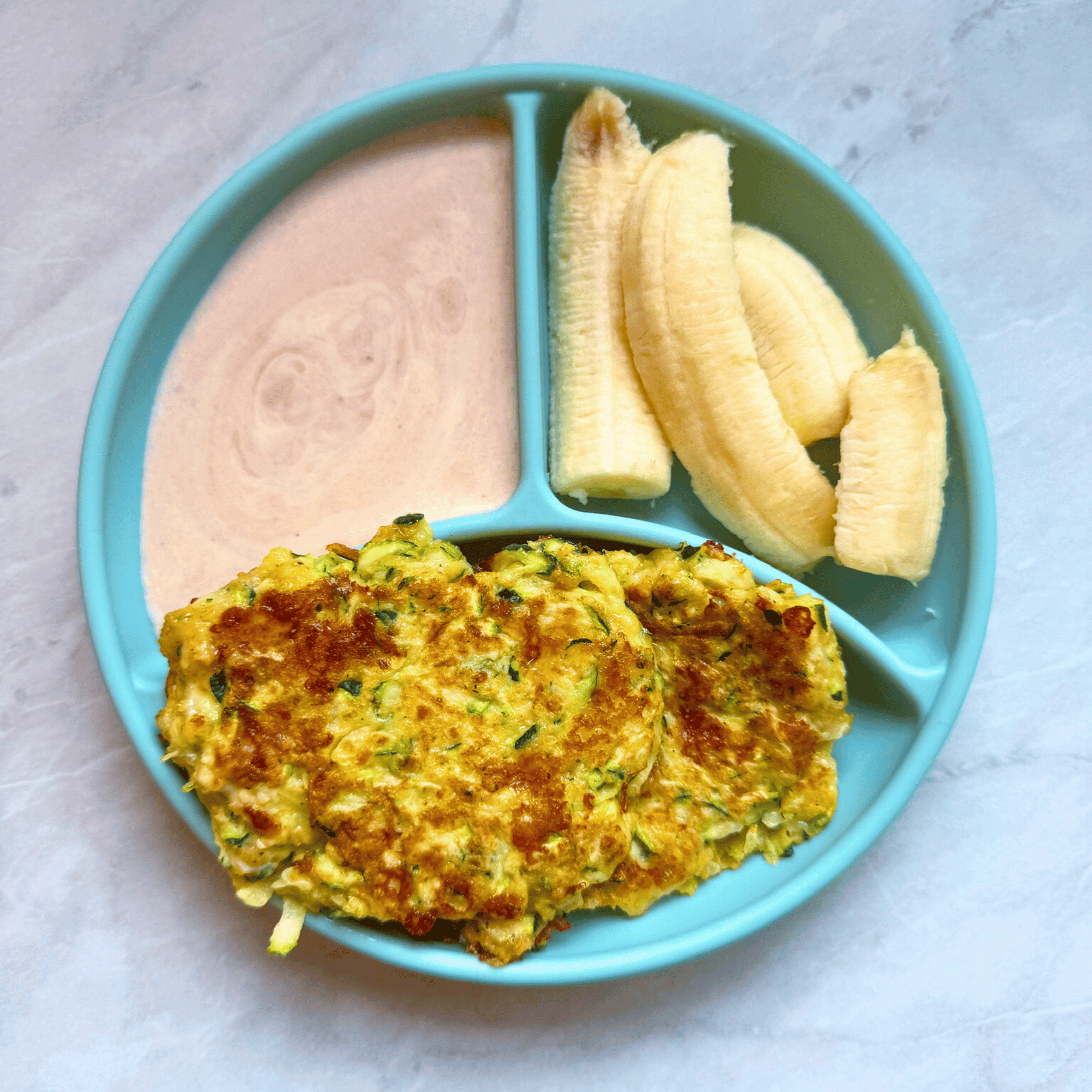 Zucchini fritters for babies with greek yoghurt and banana on the side